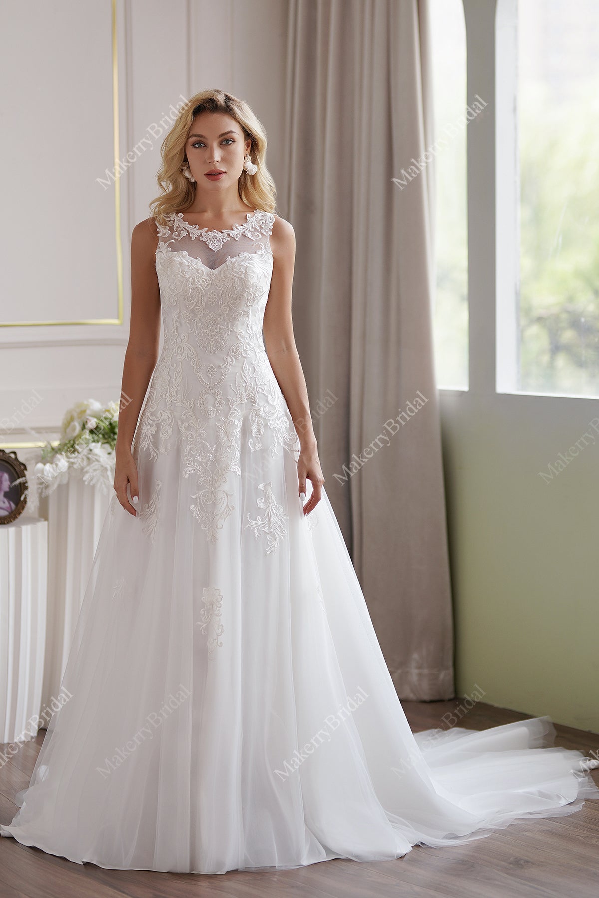 The Soft Tulle A-Line Wedding Dress Has An Illusion Neckline And Sheer Back
